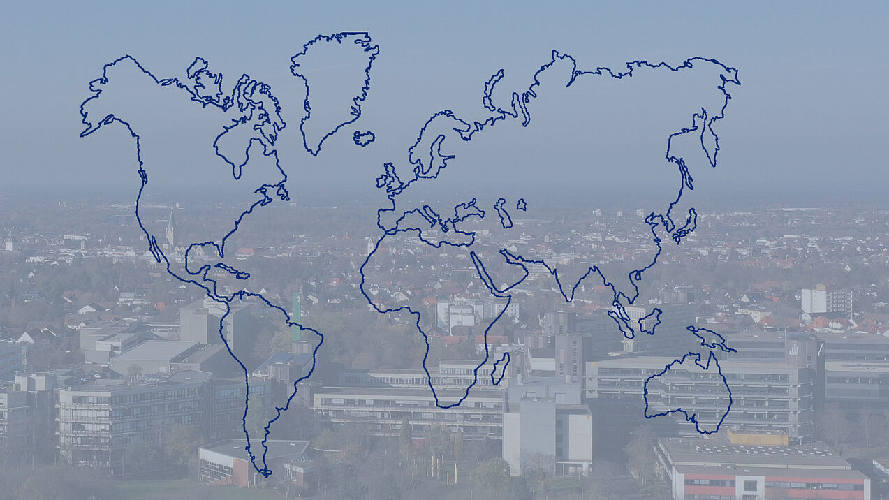 Aerial view of Paderborn University with a world map graphic in the foreground.