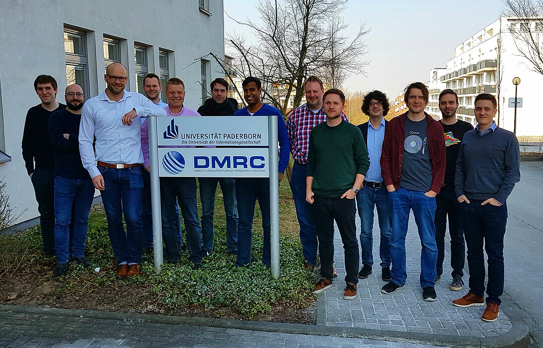 Participants and speakers of the seminar in front of the DMRC 